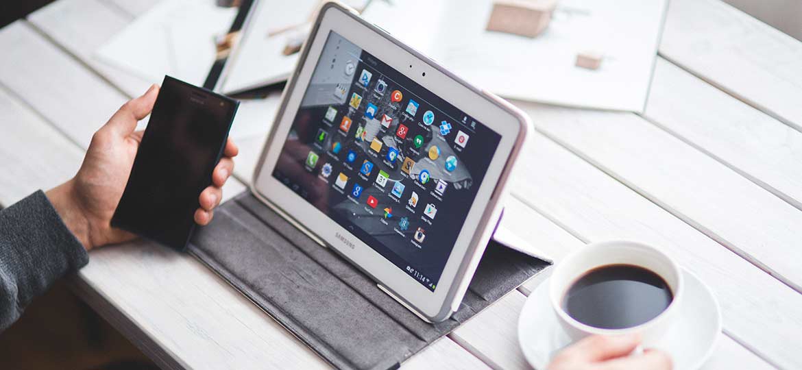 Person Drinking Coffee and Working